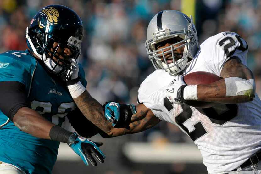 FILE - In this Dec. 12, 2010, file photo, Oakland Raiders running back Darren McFadden,...