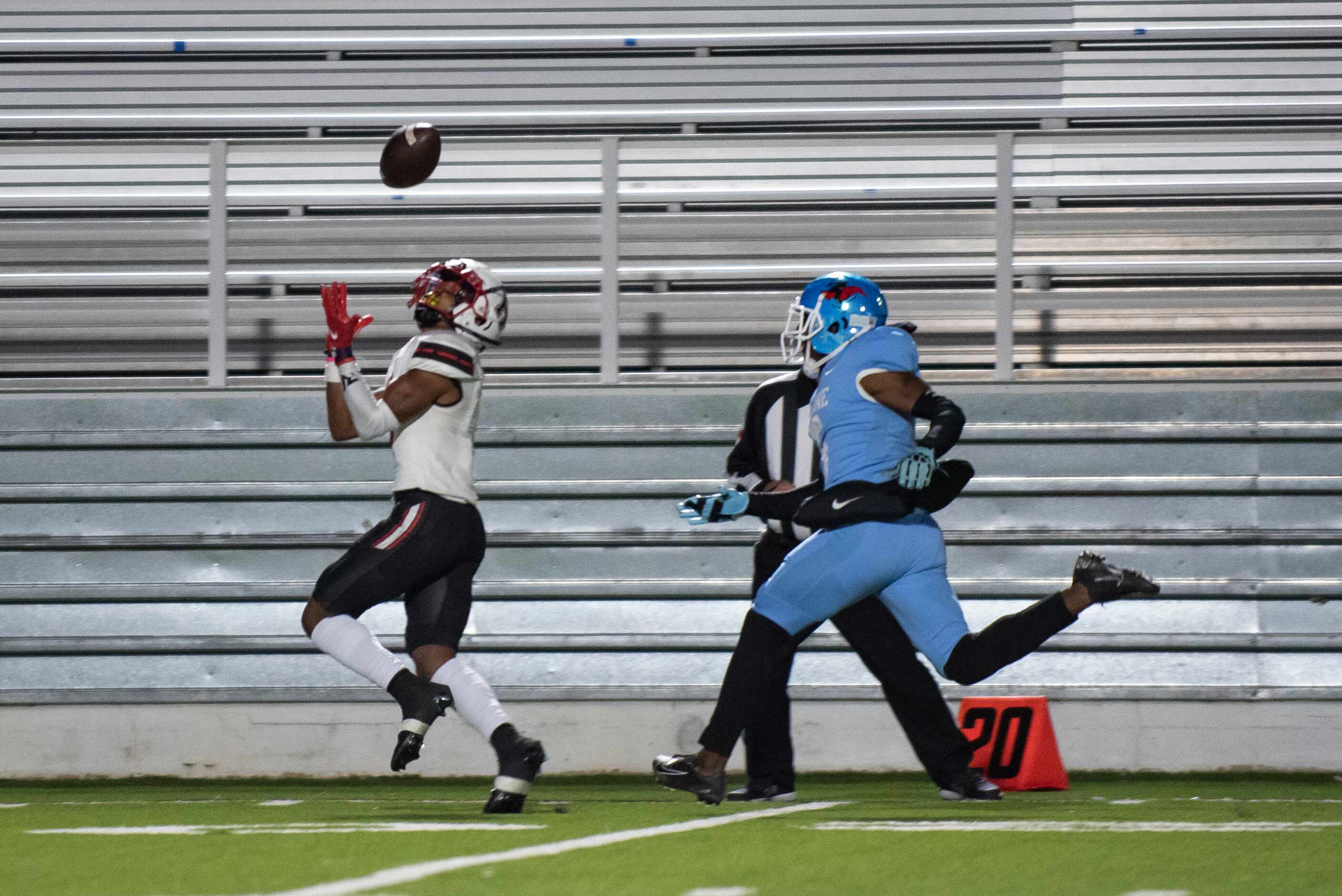 Heath senior Jay Fair (1) runs past Skyline senior Gregory Johnson (5) to catch a pass...