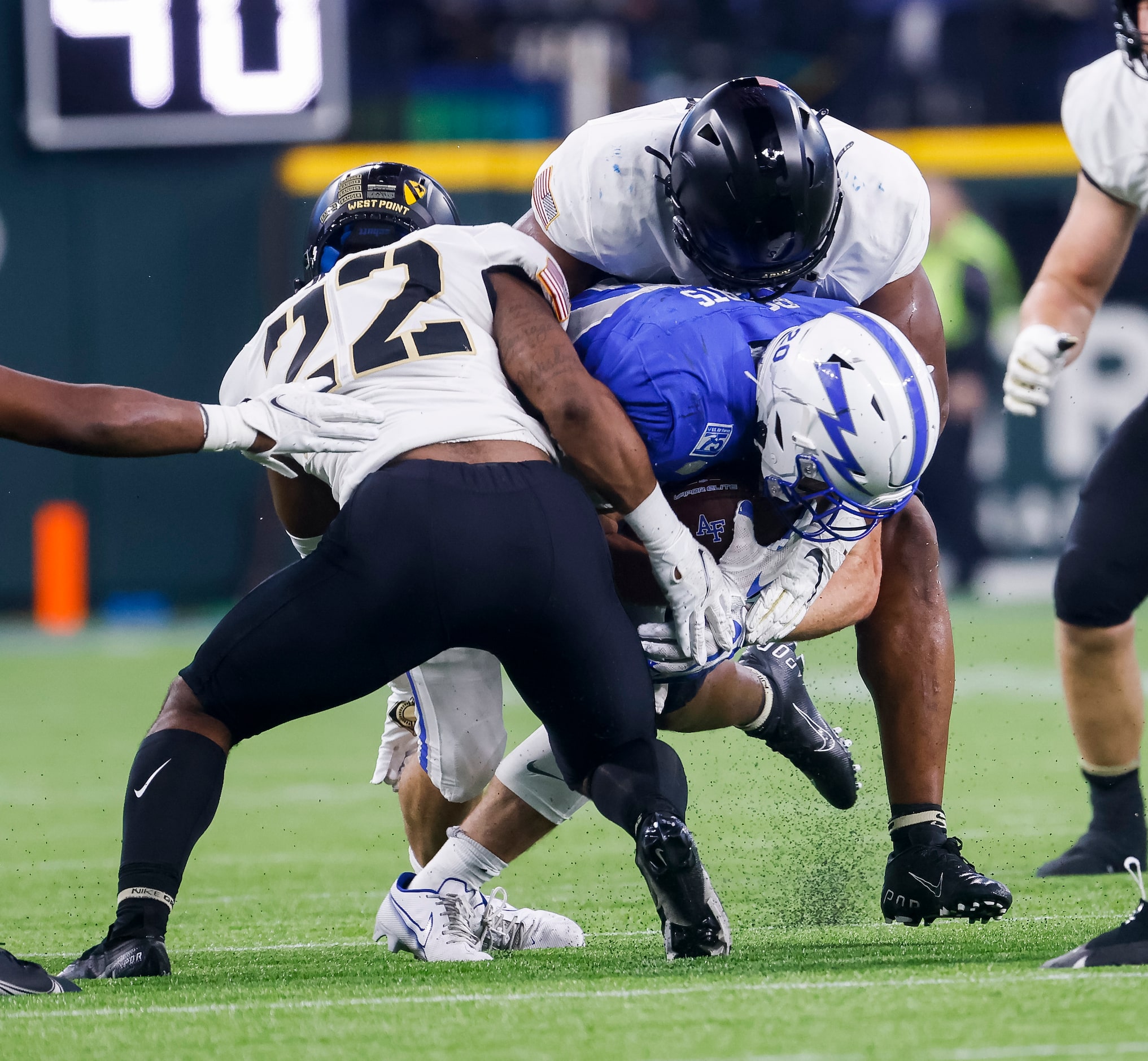 Air Force Falcons running back Brad Roberts (20) is stopped by the Army Black Knights...