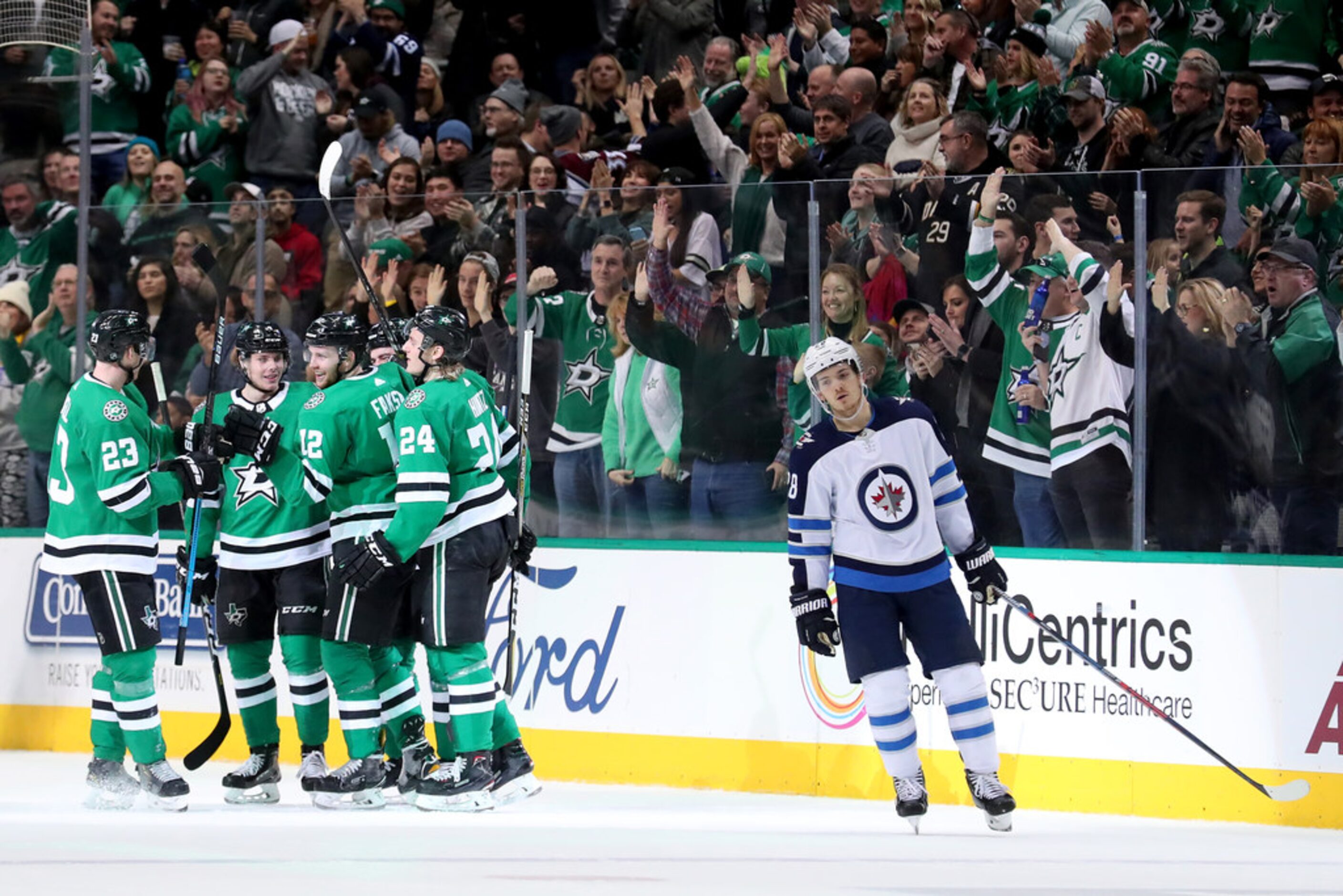 DALLAS, TEXAS - JANUARY 19: Radek Faksa #12 of the Dallas Stars celebrates with Miro...