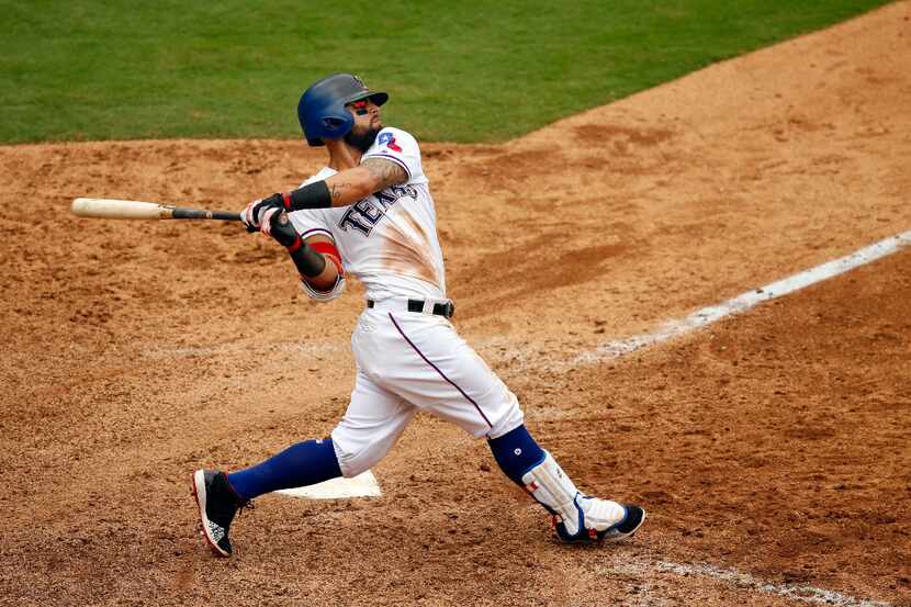 Texas Rangers second baseman Rougned Odor (12) stokes a hit against the Toronto Blue Jays at...