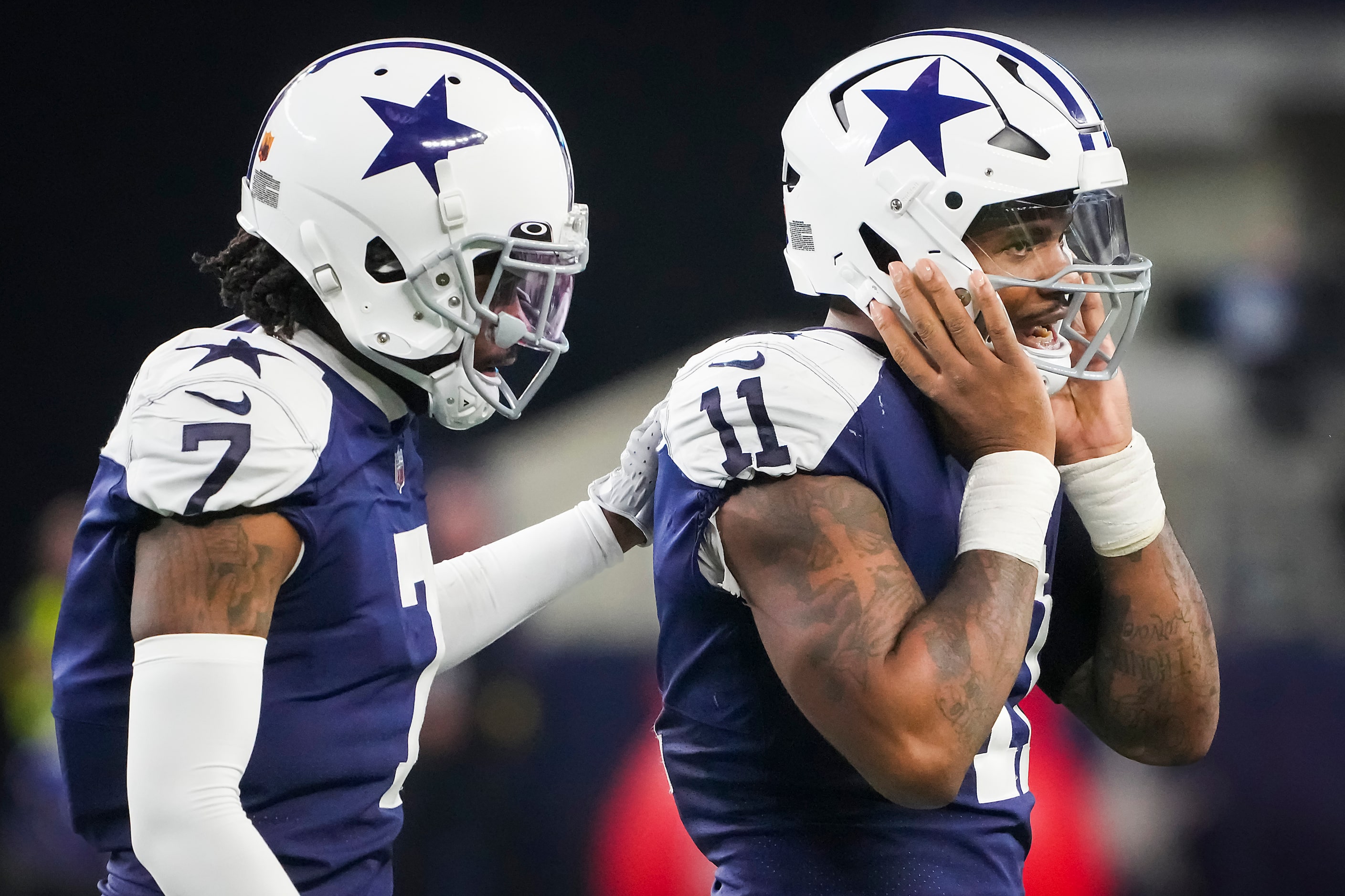 Dallas Cowboys cornerback Trevon Diggs (7) calms down linebacker Micah Parsons (11) after...