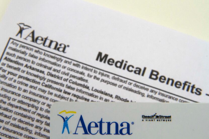 FILE - This Jan. 30, 2012 file photo, shows an Aetna benefits card in Surfside, Fla. Aetna...