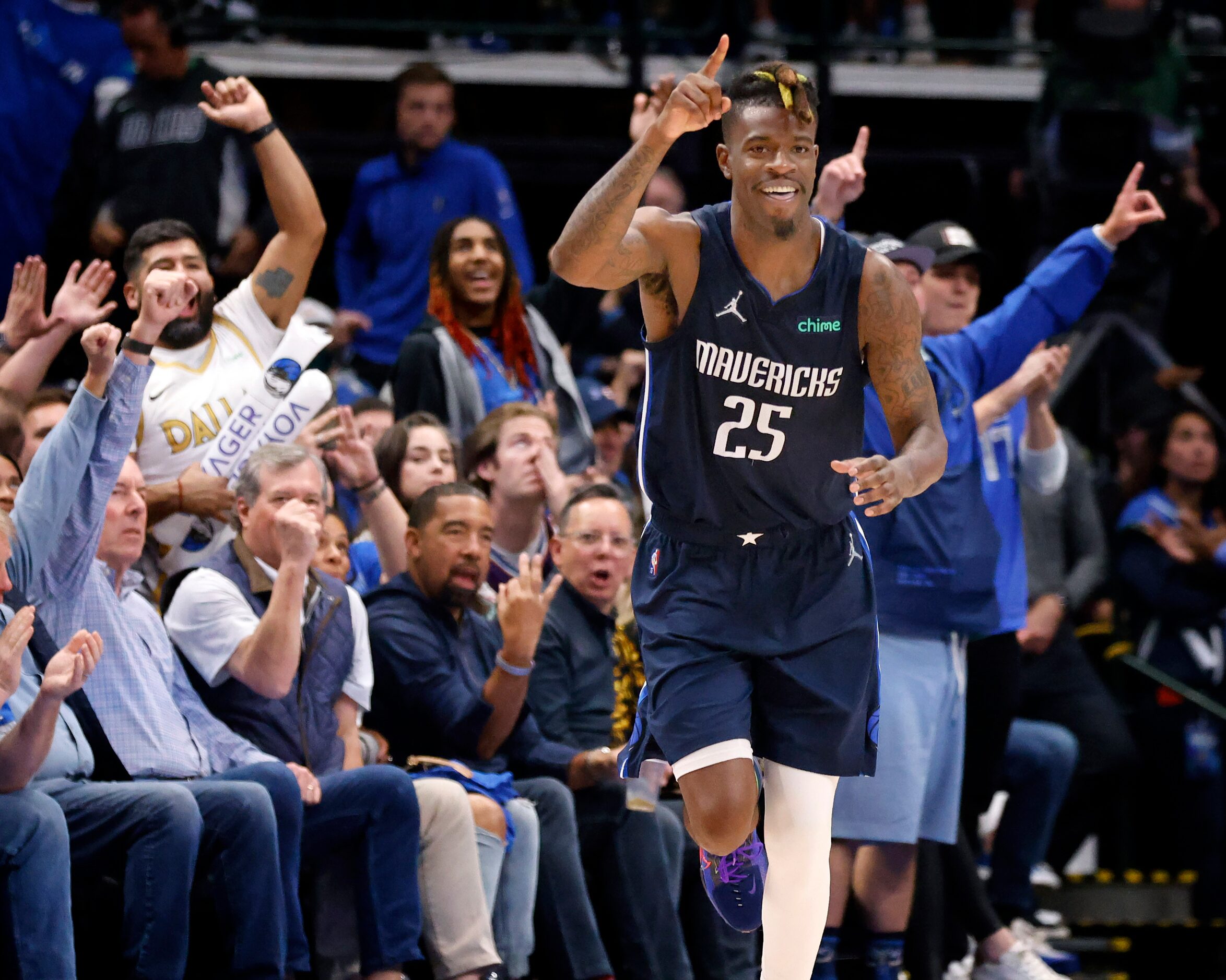 Dallas Mavericks forward Reggie Bullock (25) celebrates a fourth quarter three-pointer in...