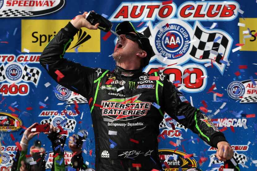 FONTANA, CA - MARCH 23:  Kyle Busch, driver of the #18 Interstate Batteries Toyota,...