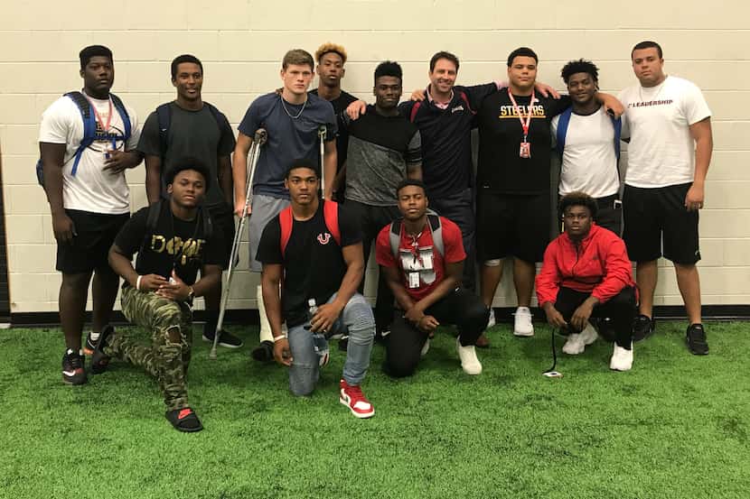Members of the Allen football team with Ty Hardee