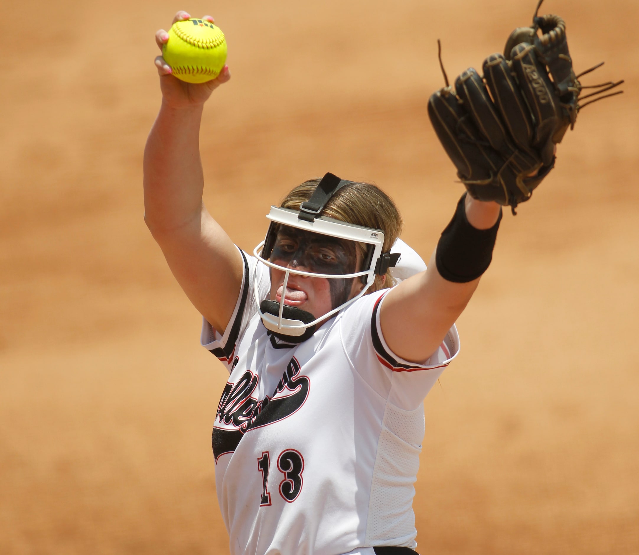 Colleyville Heritage pitcher Lindsey McConnell (13) delivers a pitch to a Comal Canyon...