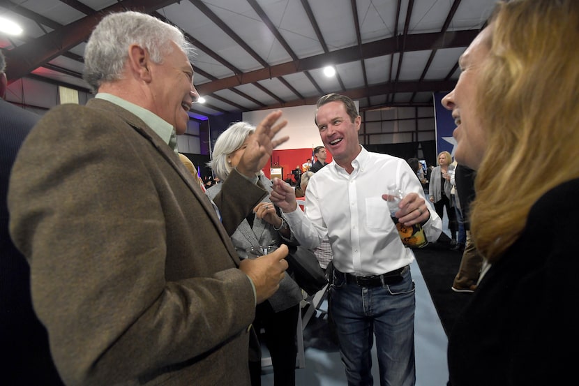 Dade Phelan greets guests, including Orange County Judge John Gothia, at his campaign rally...