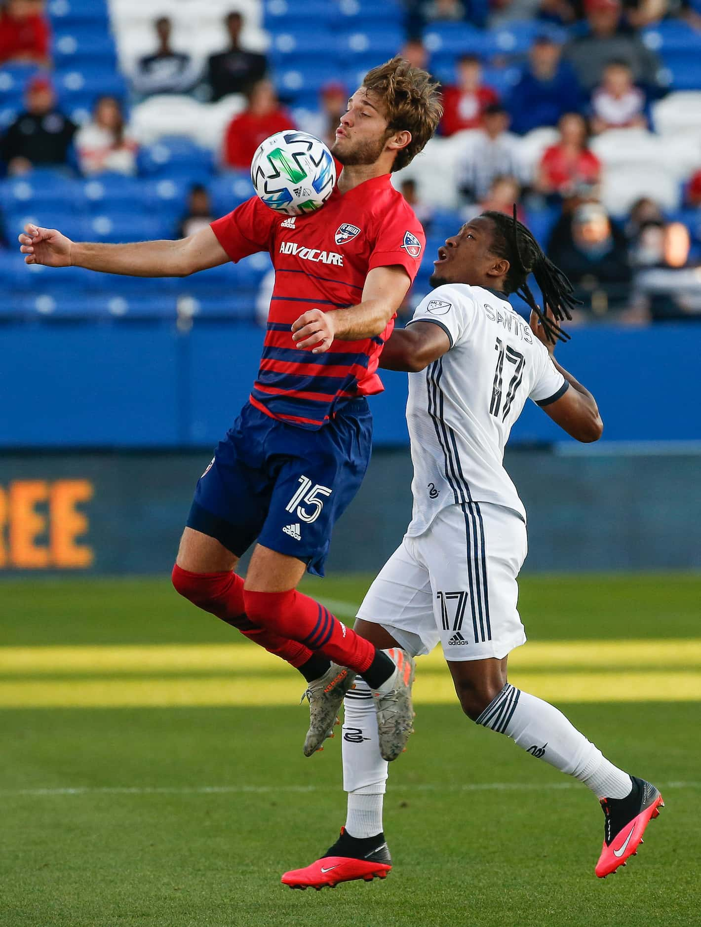 FC Dallas midfielder Tanner Tessmann (15) receives the ball over Philadelphia Union attacker...