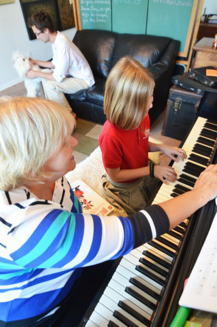 Lily Jones (9) of Garland Christian Academy practices private piano lessons for her upcoming...