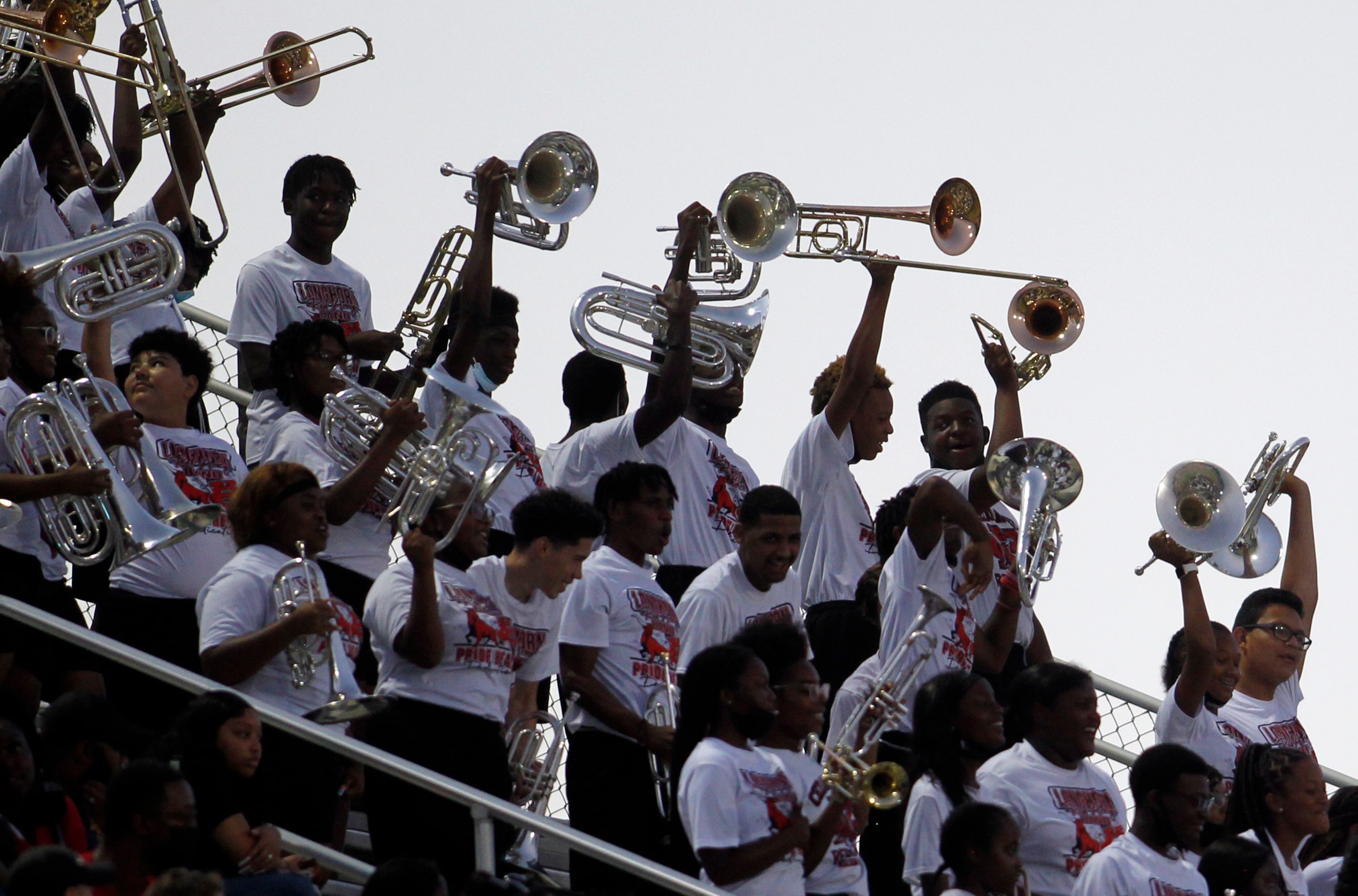 Cedar Hill band members celebrate a first half Longhorn touchdown during their game against...