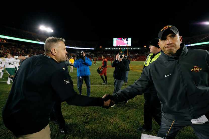 Baylor head coach Matt Rhule, left, shakes hands with Iowa State head coach Matt Campbell,...