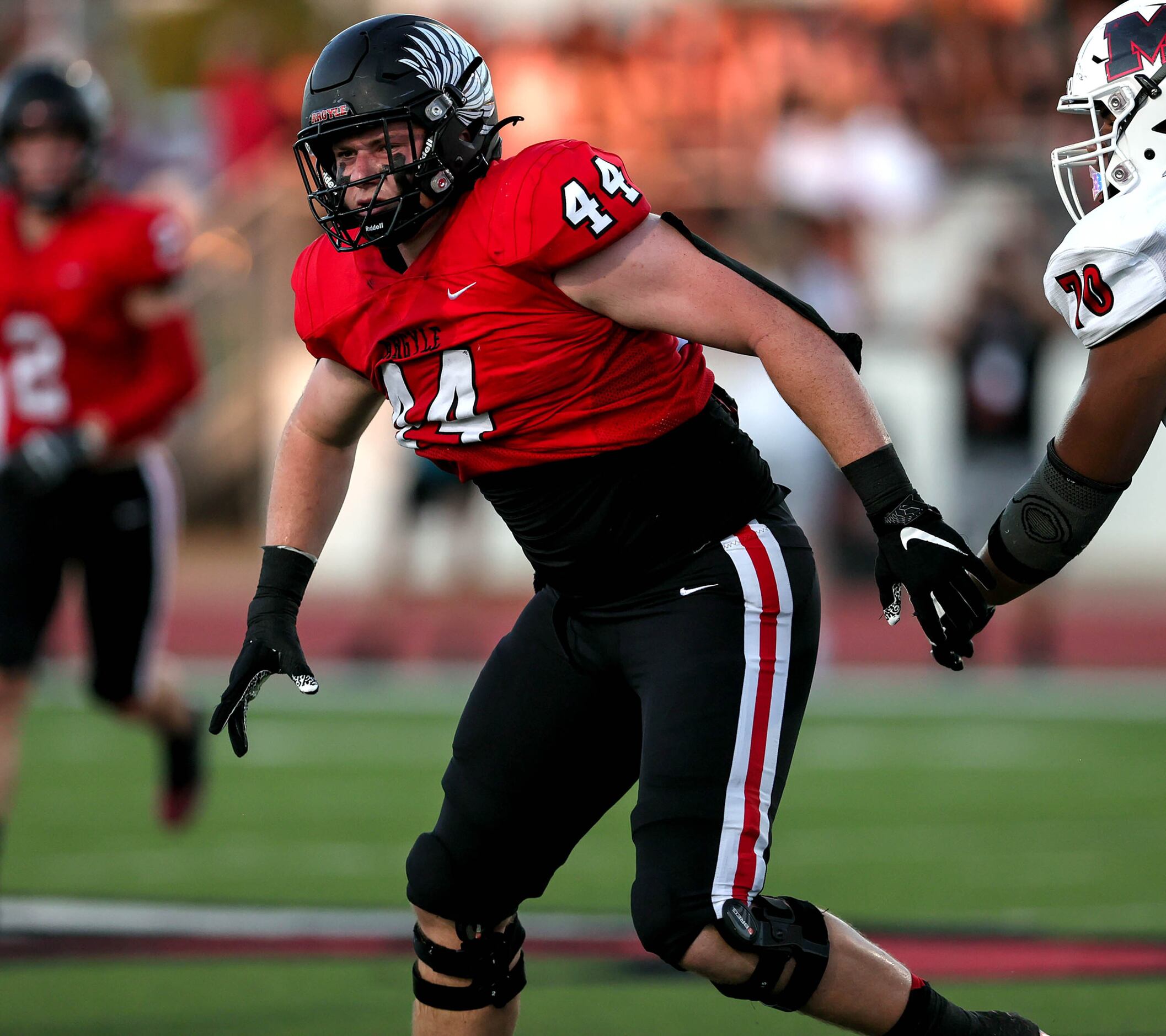 Argyle defensive end Riley Van Poppell (44) plays against Melissa in a high school football...