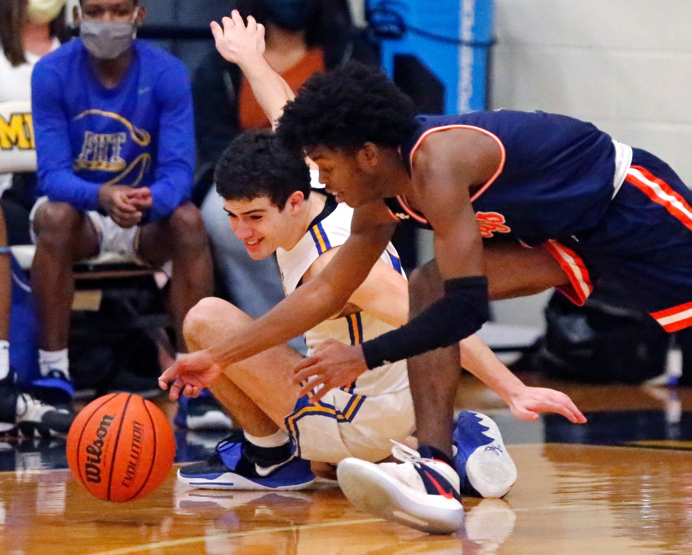 Frisco High School guard Daniel Meneses (15) has the ball stolen by McKinney North High...