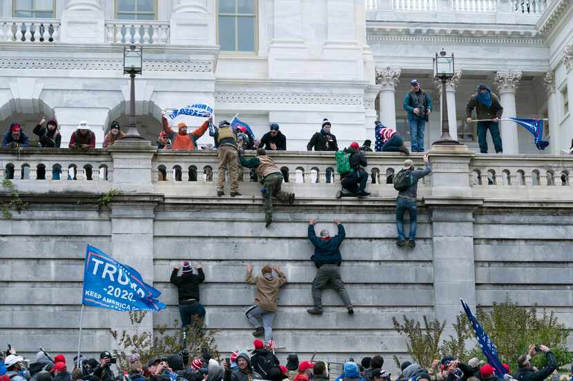 Violent insurrectionists loyal to then-President Donald Trump climbed the west wall of the...