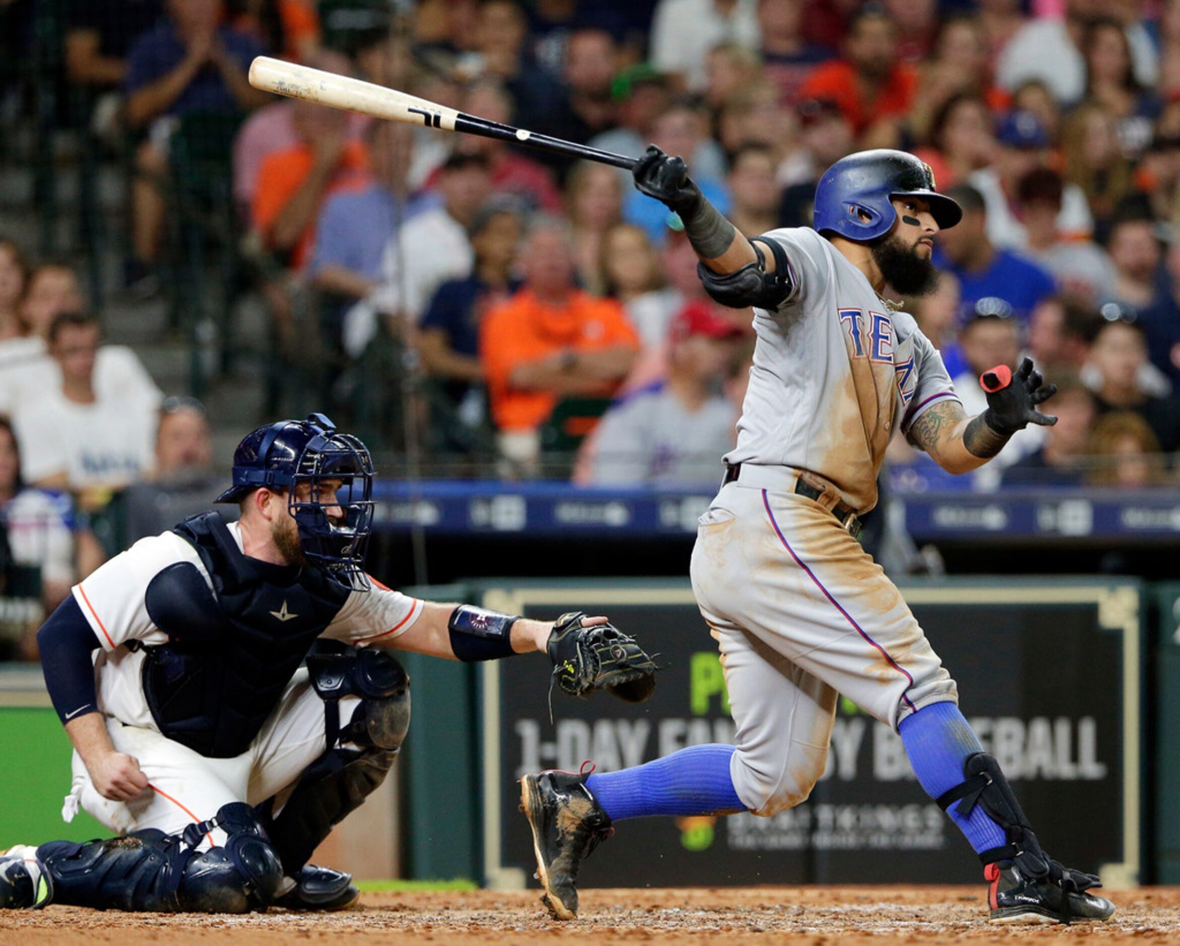 Texas Rangers' Rougned Odor, right, watches his second home run of the night in front of...