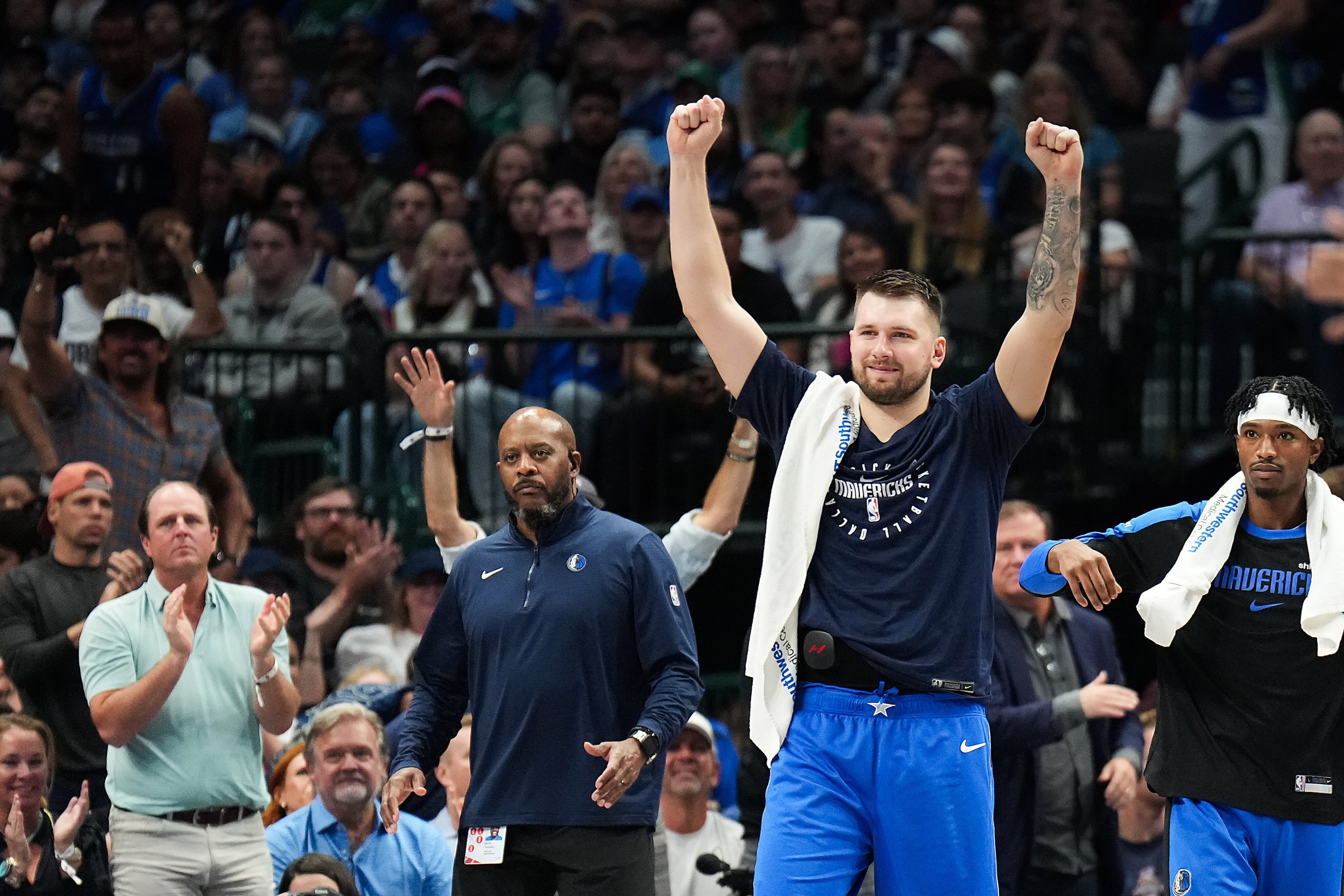 Dallas Mavericks guard Luka Doncic celebrates a dunk by center Dereck Lively II during the...