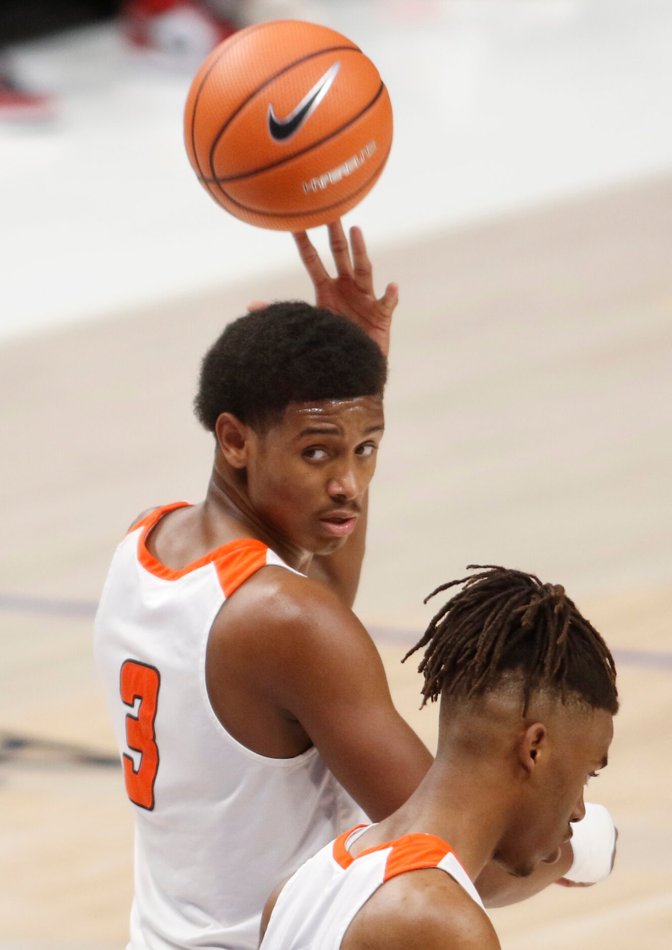 Lancaster's Markies Sykes (3) tosses the ball over his shoulder to a game official as the...