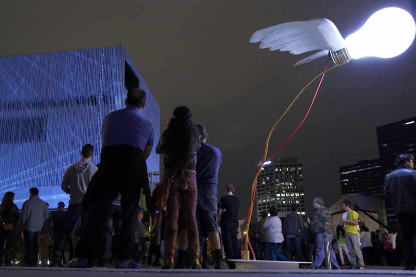 Aurora lights up the Dallas Arts District on Friday.