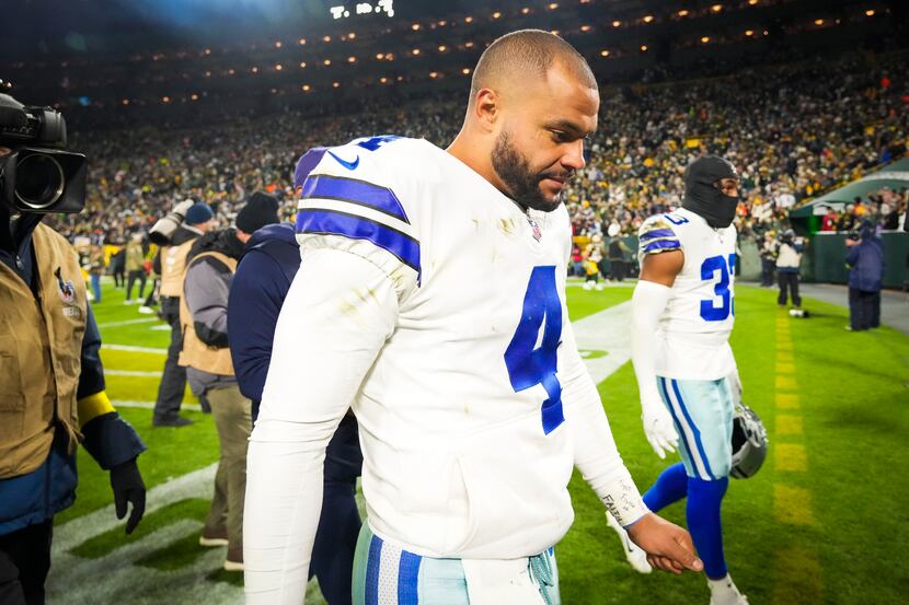 Dallas Cowboys quarterback Dak Prescott leaves the field after an overtime loss to the Green...