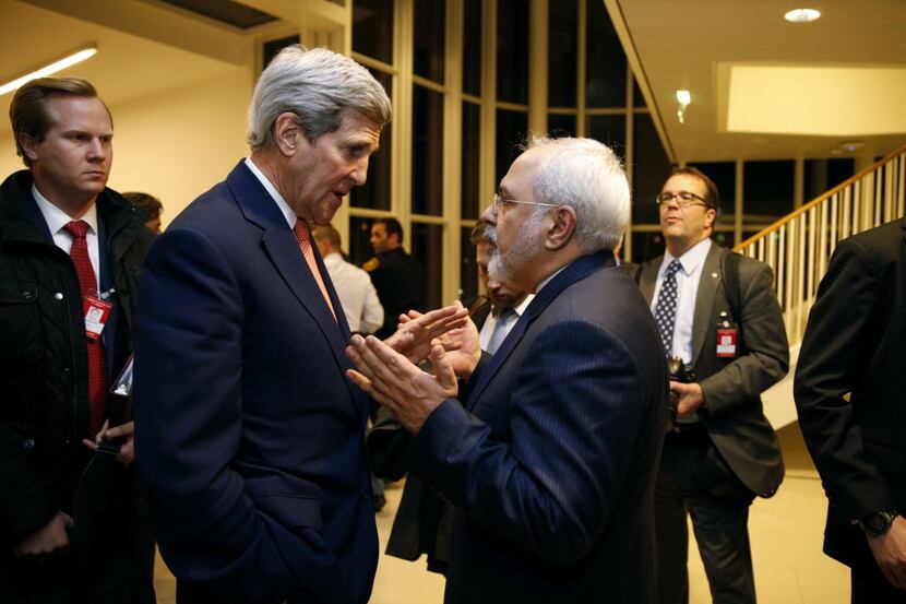 U.S. Secretary of State John Kerry talks with Iranian Foreign Minister Mohammad Javad Zarif,...