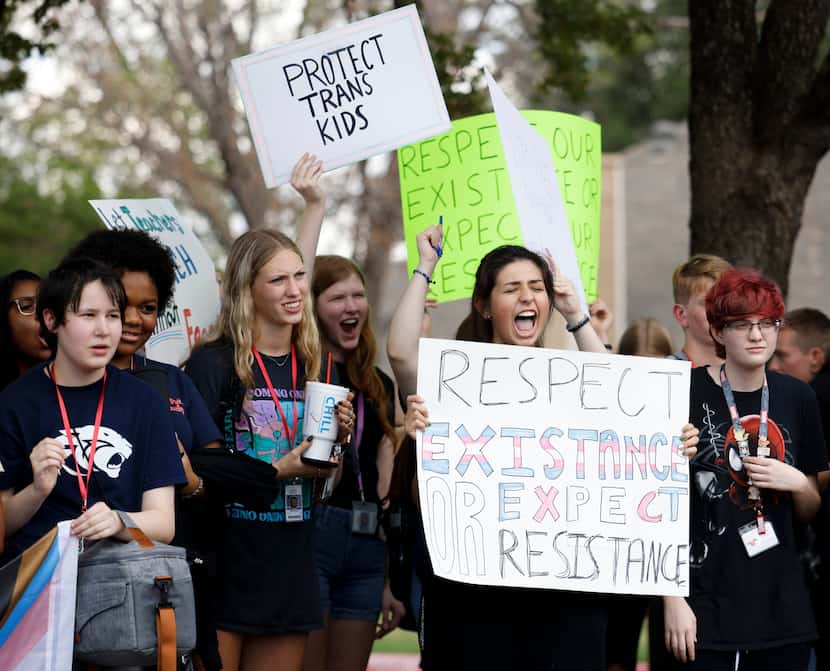 Grapevine High School students protest during a third-period walkout in protest of a new...