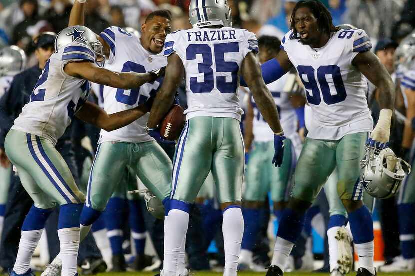 Dallas Cowboys strong safety Kavon Frazier (35) is congratulated by defensive end Demarcus...