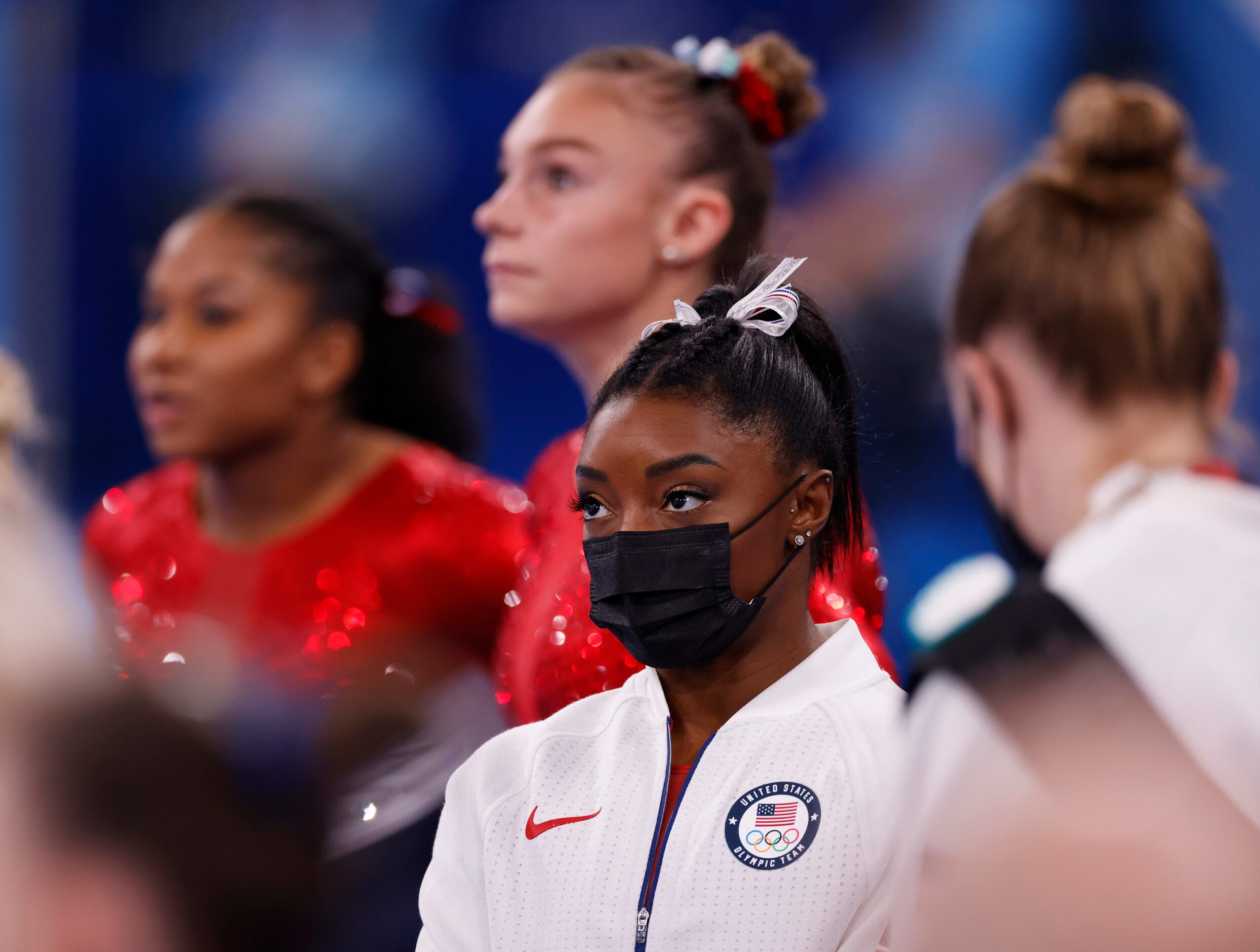 USA’s Simone Biles watches after pulling out of the competition after the vault event during...