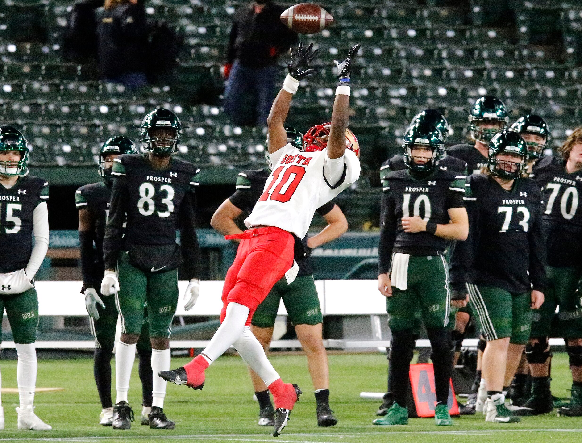 South Grand Prairie High School wide receiver Matthew Ramirez (10) makes a catch for a first...