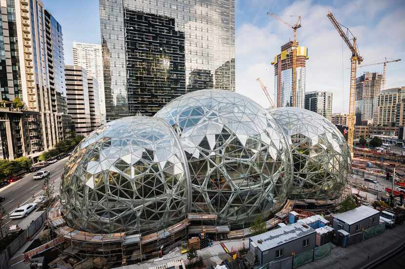 Amazon Tower II rises above the Amazon Biospheres in Seattle. (Christopher Miller/The New...