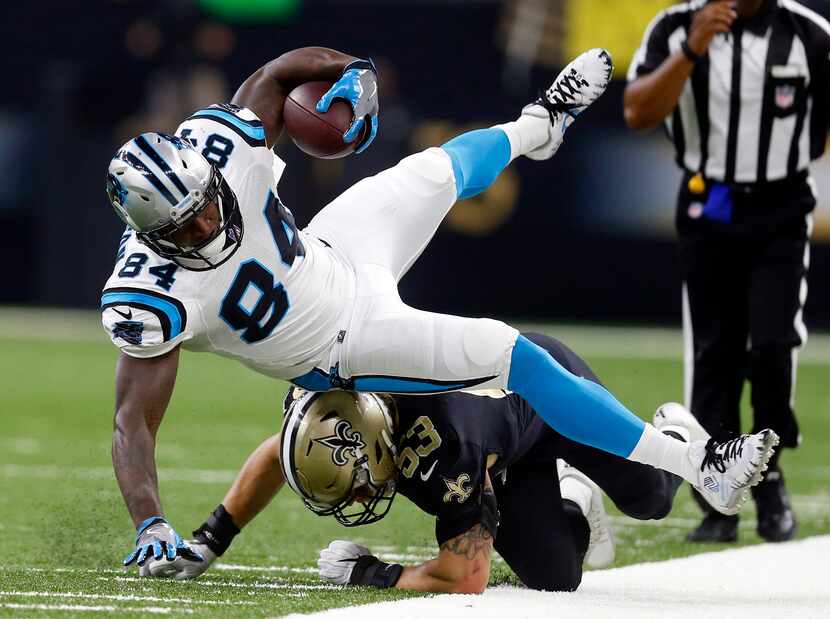 Carolina Panthers tight end Ed Dickson (84) is upended by New Orleans Saints outside...