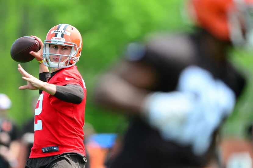 Cleveland Browns quarterback Johnny Manziel (2) looks to pass during organized team...