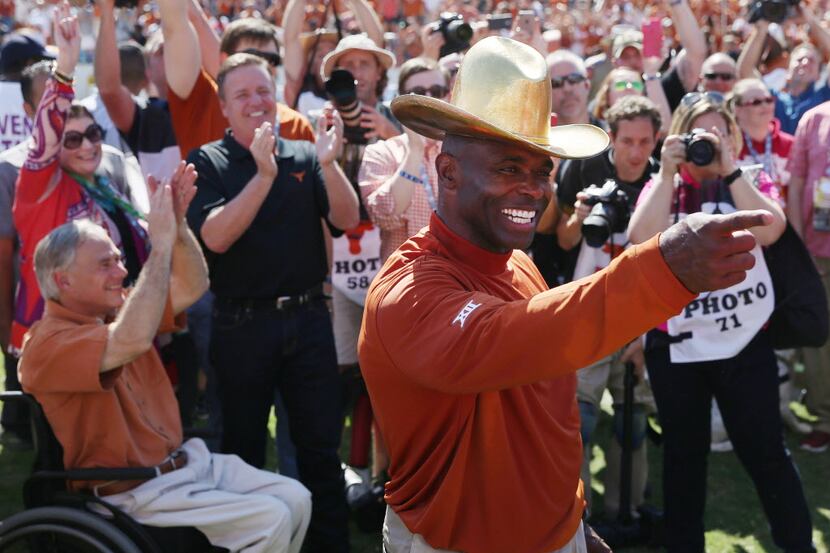 Texas head coach Charlie Strong celebrates after their 24-17 win over Oklahoma in an NCAA...