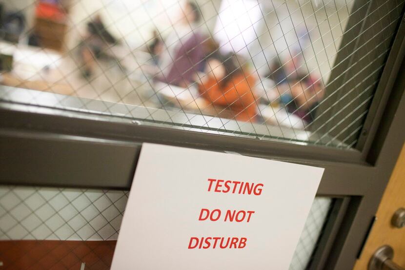 A sign warns guests that students are testing, at Akins High School in Austin.  