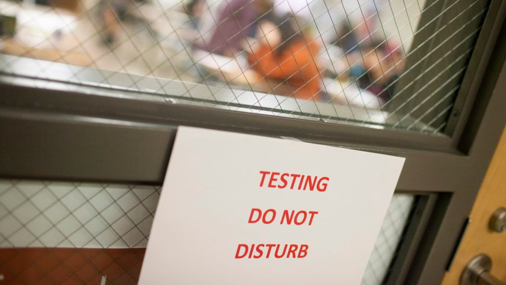 A sign warns guests that students are testing, at Akins High School in Austin.  