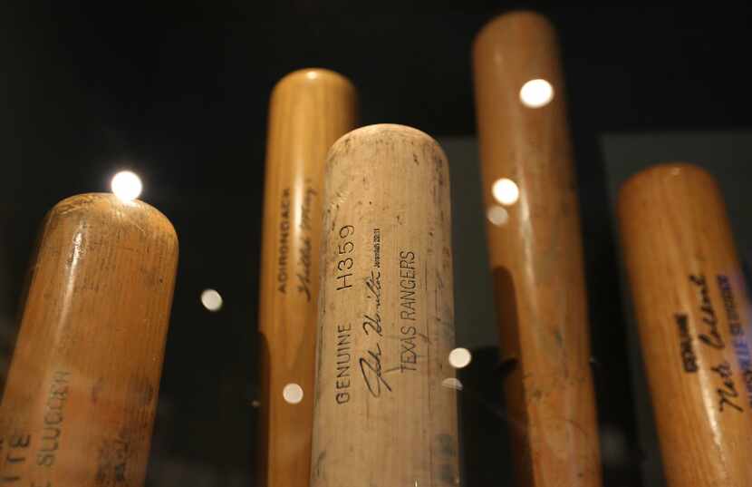 The bat (center) that Texas Rangers slugger Josh Hamilton used to hit four home runs in one...