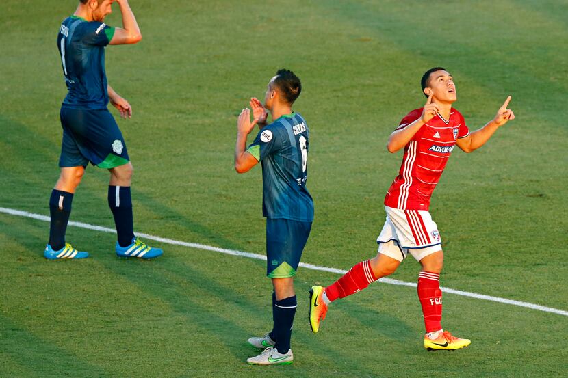 FC Dallas midfielder Carlos Lizarazo, right, celebrates his goal against Oklahoma City...