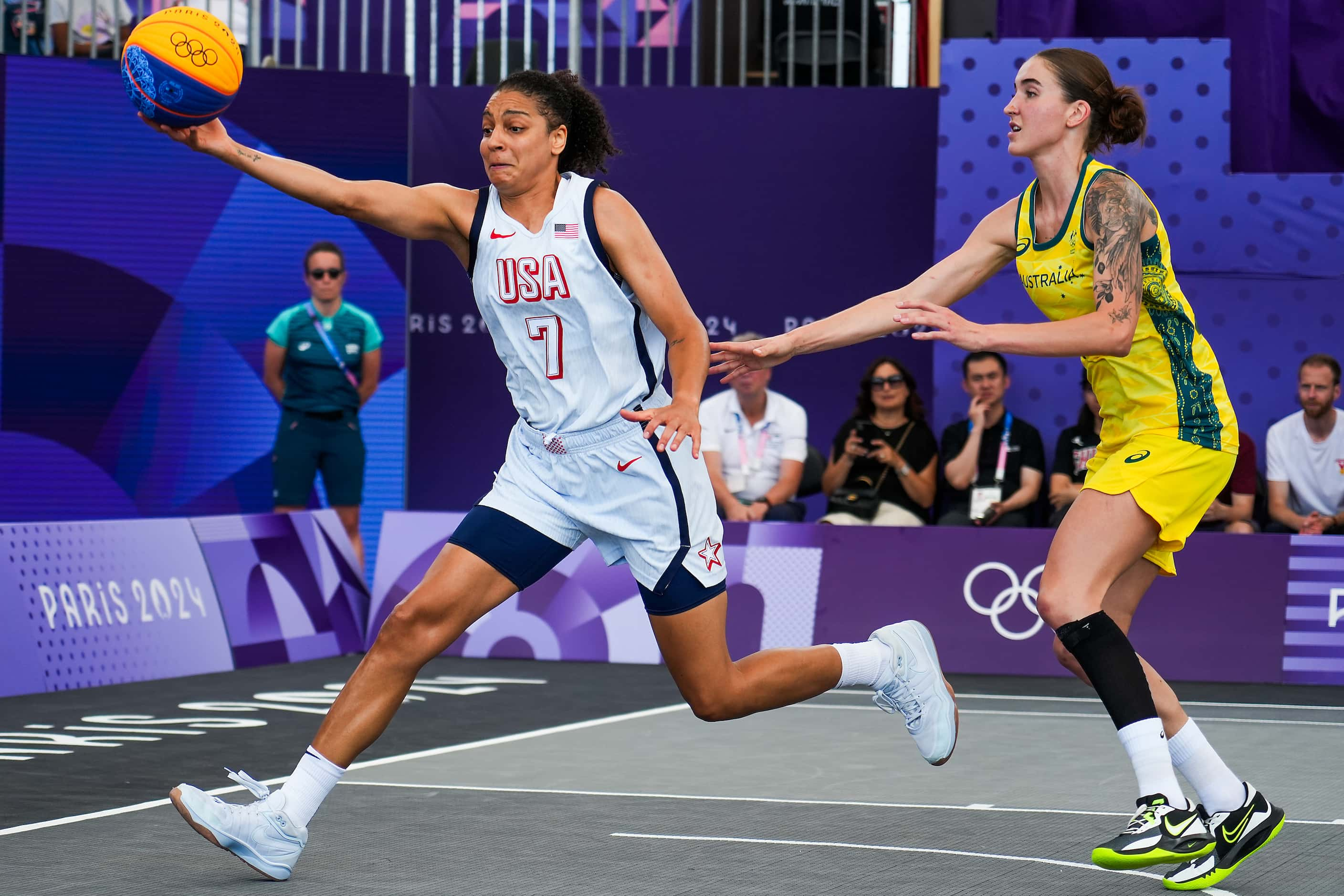 Cierra Burdick of the United States (7) reaches for a loose ball against Anneli Maley of...