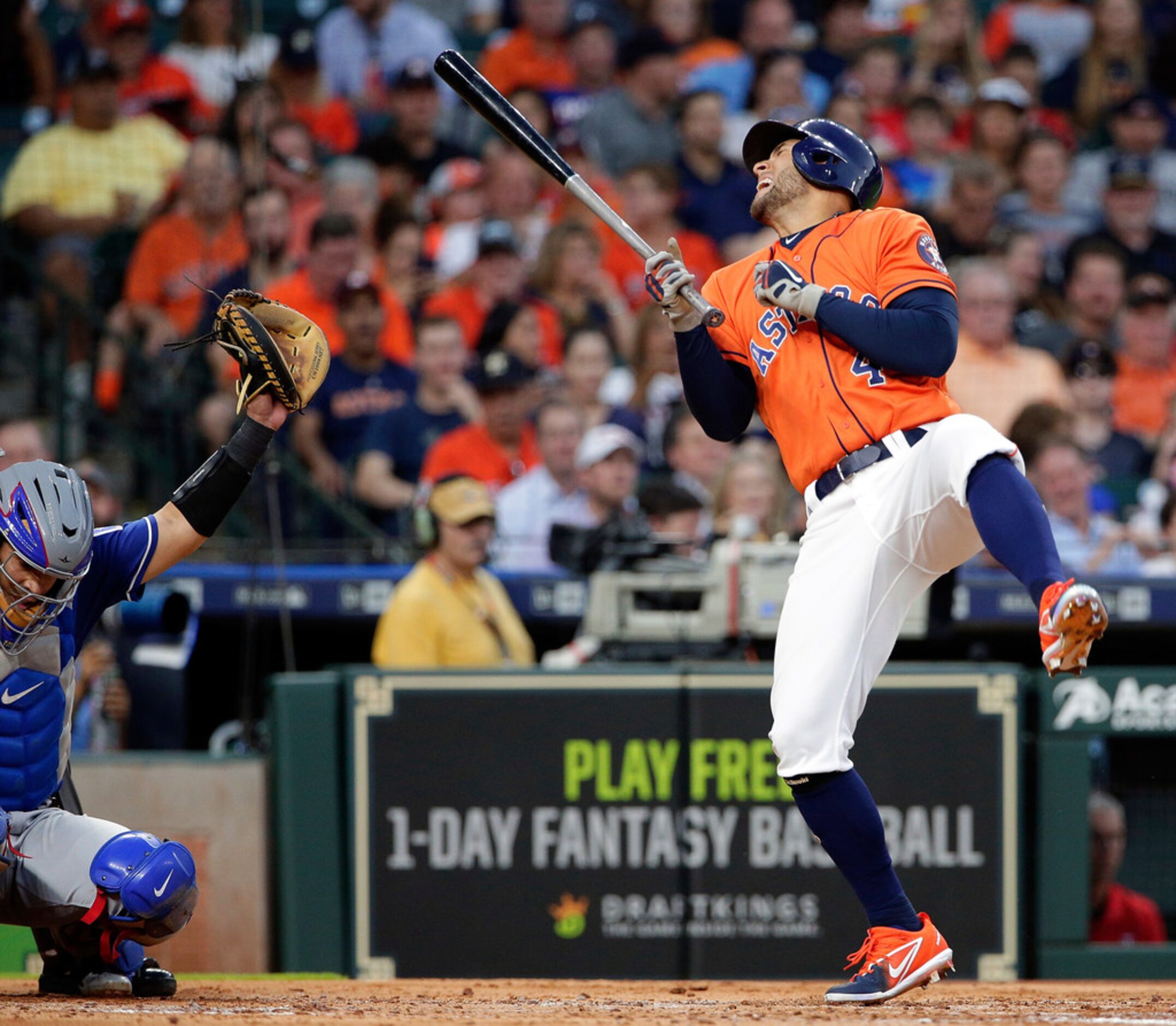 Houston Astros George Springer (4) reacts after getting hit by a pitch from Texas Rangers'...