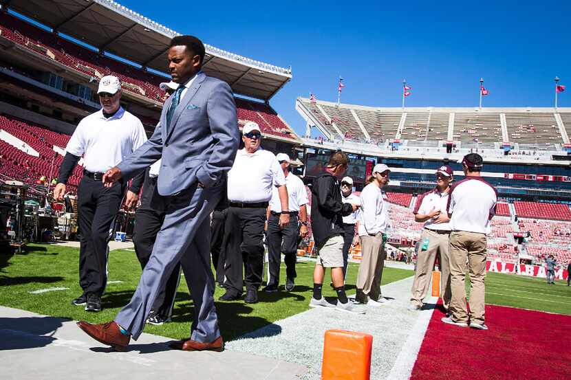 Texas A&M head coach Kevin Sumlin walks the field before an NCAA college football game...