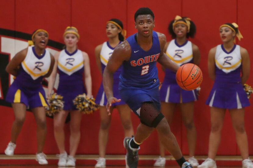 South Garland's Chris Harris Jr. (2) clears a rebound in front of a group of Richardson...