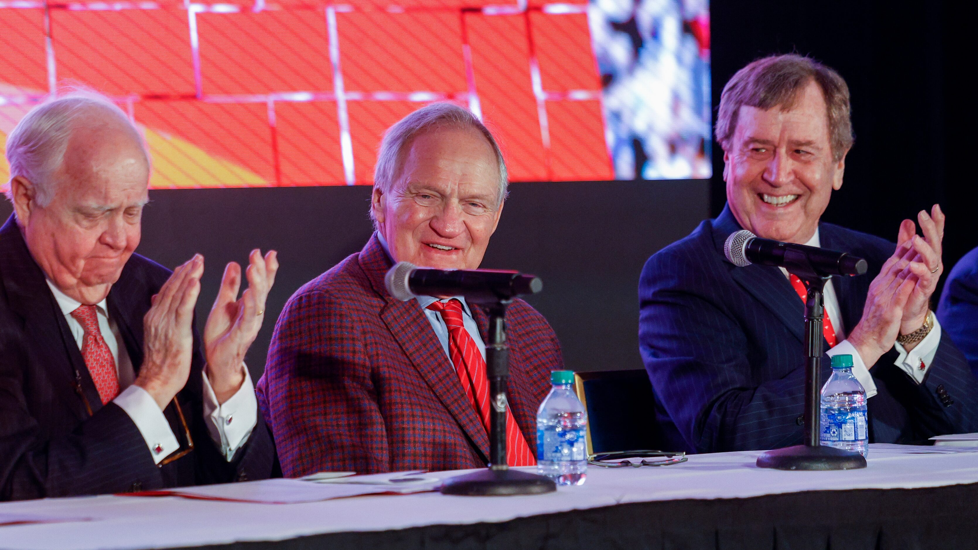 SMU alumnus Gerald J. Ford (left) and SMU President R. Gerald Turner (right) applaud SMU...