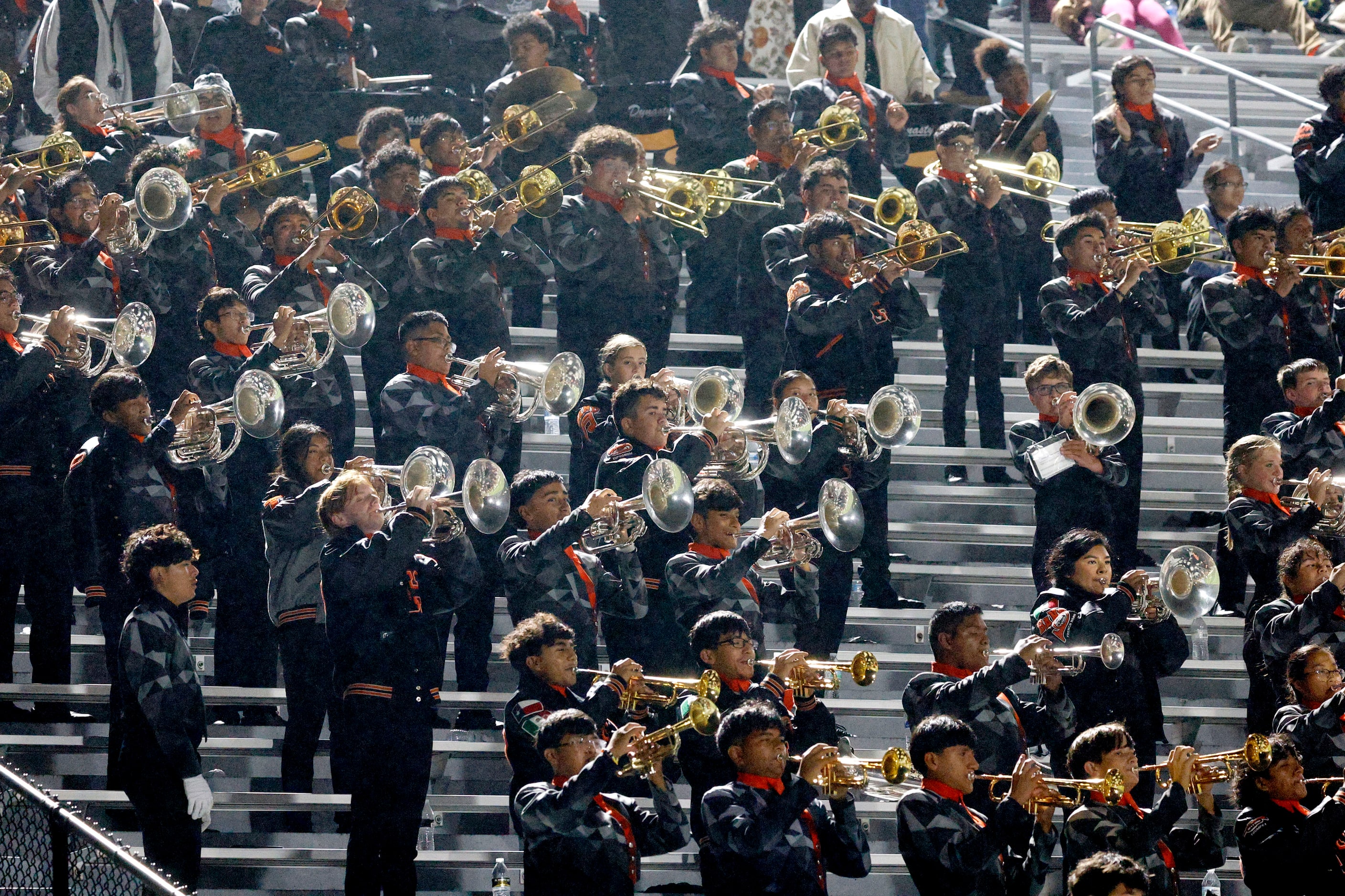 Haltom marching band performs in the second half of a high school football game against Sam...