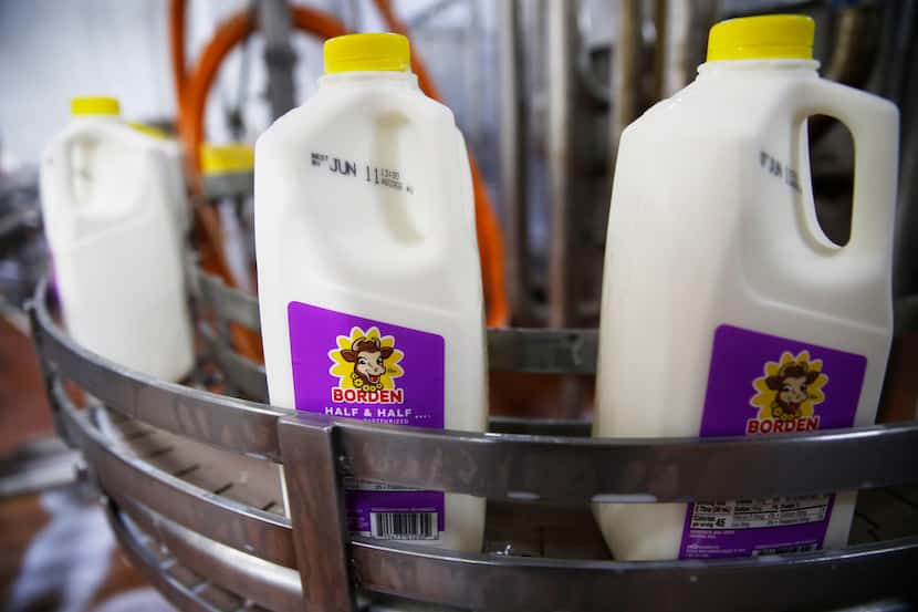Bottles of half & half make their way through the bottling line at Borden Dairy Co. in Dallas.