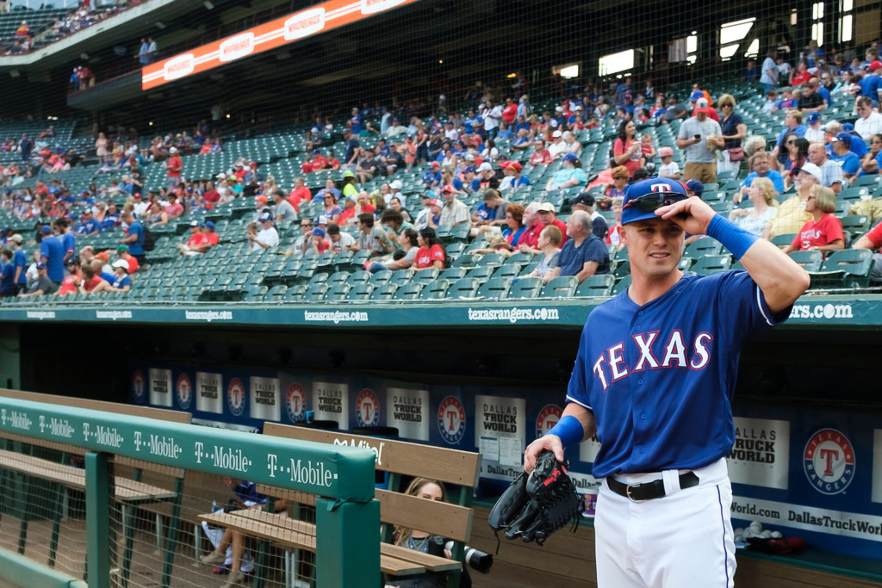 Texas Rangers outfielder Scott Heineman looks out over the stadium as he takes the field to...