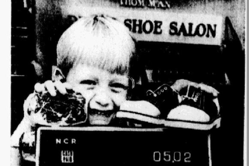 Snip from the article published Aug. 5, 1973. "Danny Muzolf, 3, of Irving displays a wide...