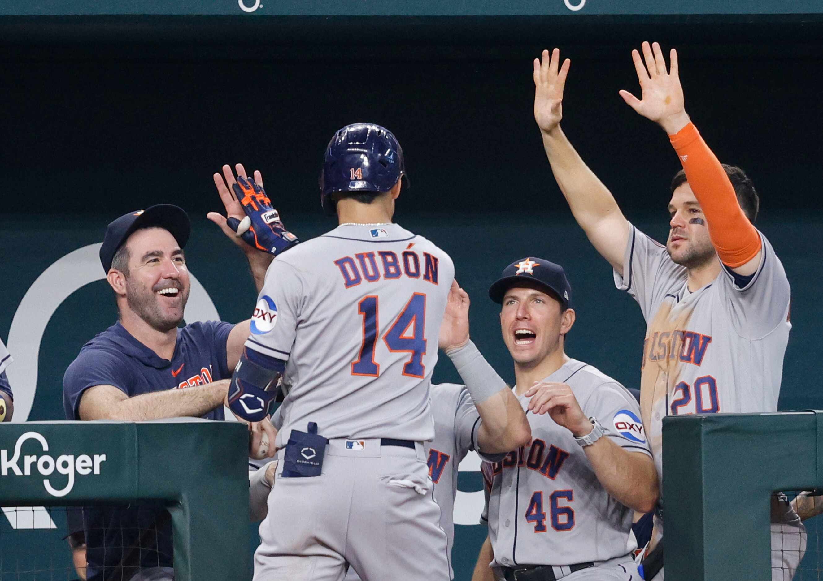 Houston Astros second baseman Mauricio Dubon (14) celebrates with his teammates after...