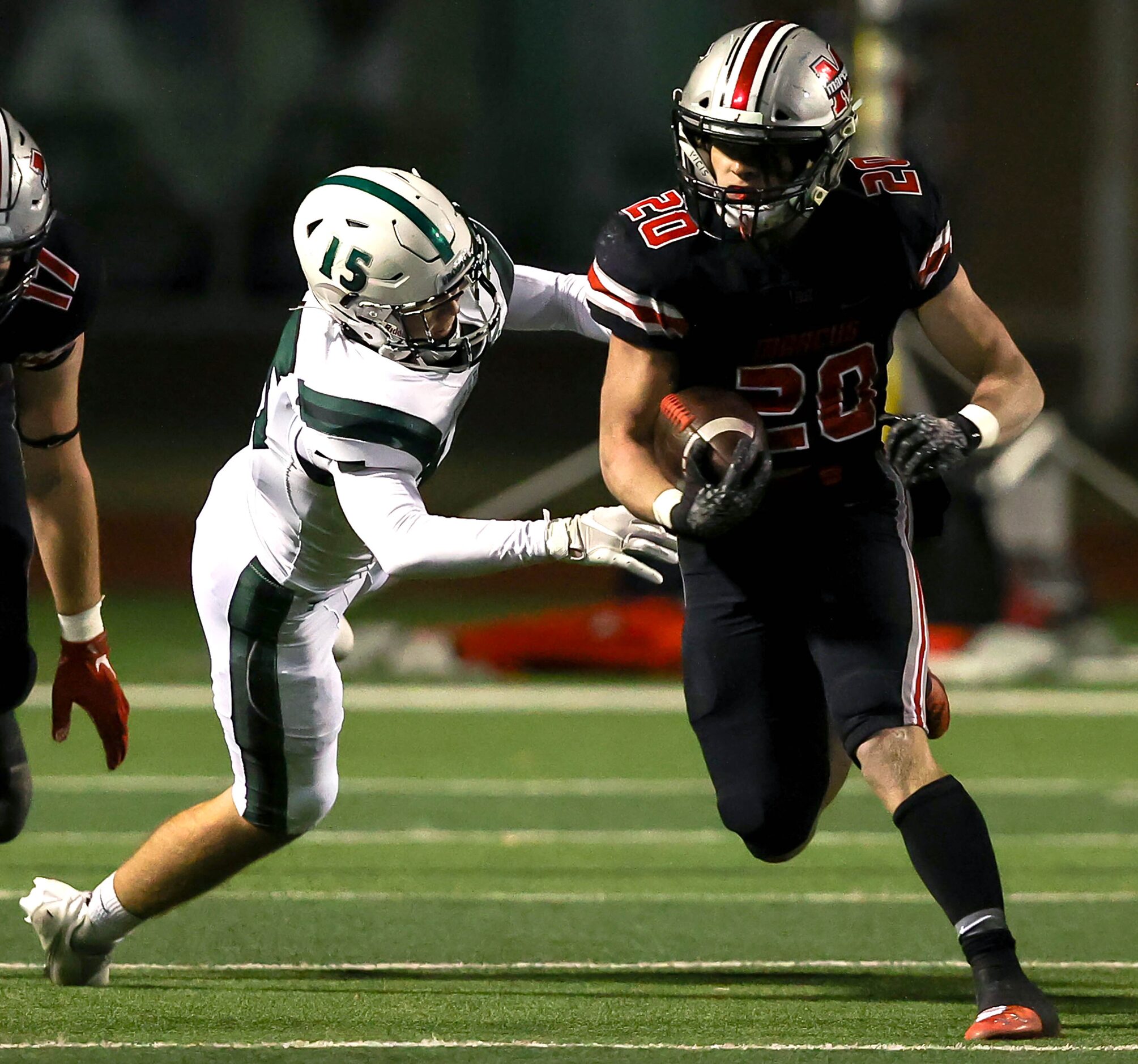 Flower Mound Marcus running back Walker Wells (20) gets past Prosper linebacker Graydon...