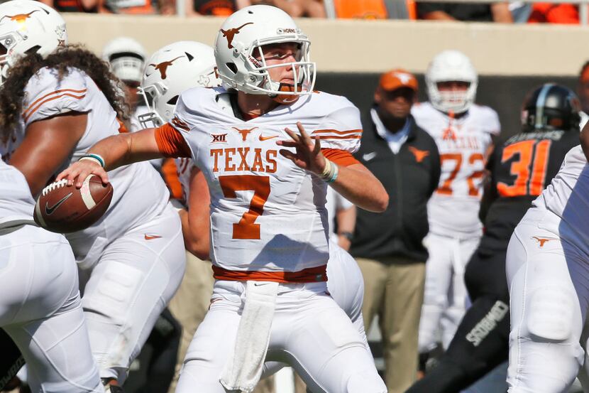 Texas quarterback Shane Buechele (7) throws in the fourth quarter of an NCAA college...