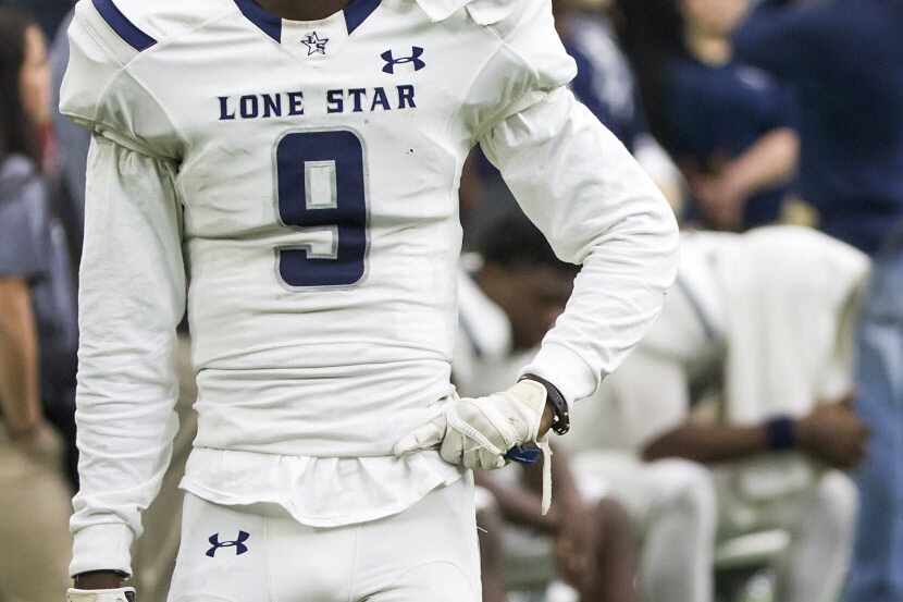 Frisco Lone Star wide receiver Michael Johnson (9) paces the sidelines during the final...